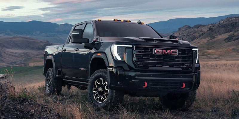 GMC Sierra 2500 HD showcasing rugged design across Trims in an off-road setting.