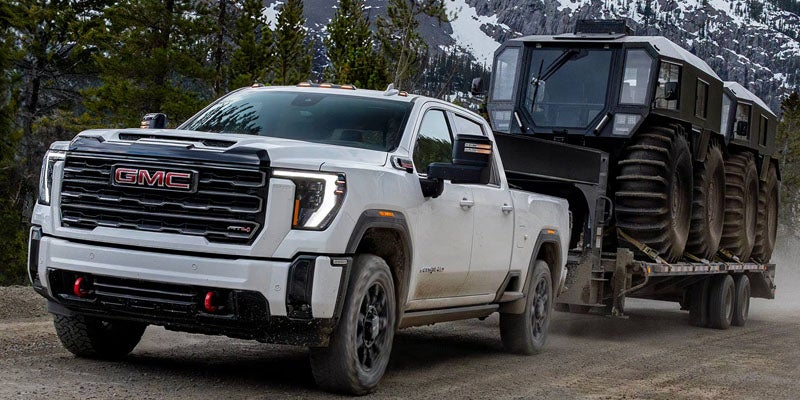 GMC Sierra 2500 HD towing a heavy off-road vehicle